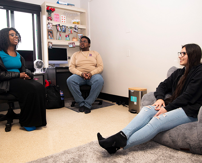 Students in a dorm room.